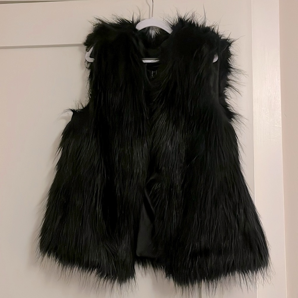 Faux fur vest with pockets.